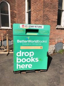 A green collection bin labeled "Drop Books Here" provided by Better World Books.